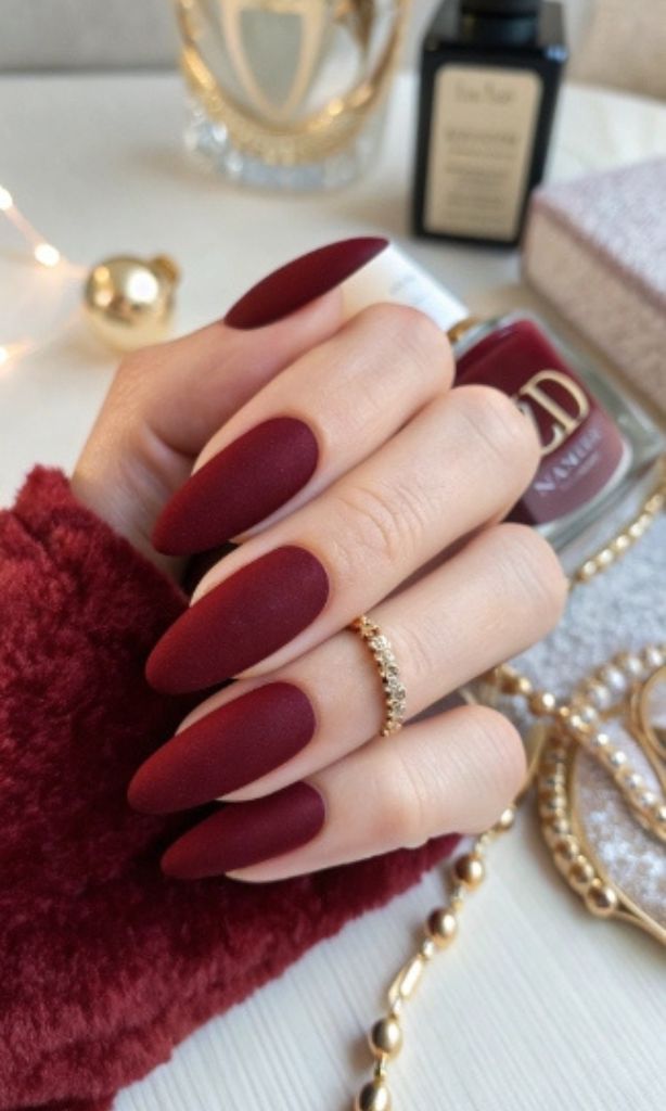 It is image on Burgundy Red Matte Almond Nails Fall Design.
