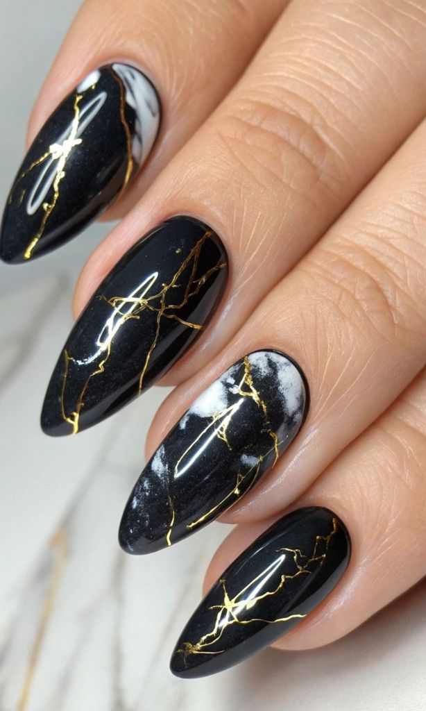 It is image on Glossy Black Nails With Gold Marble Art.