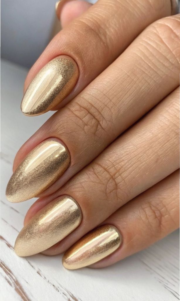 It is image on Gold Chrome Mirror Finish Almond Shape Nails.