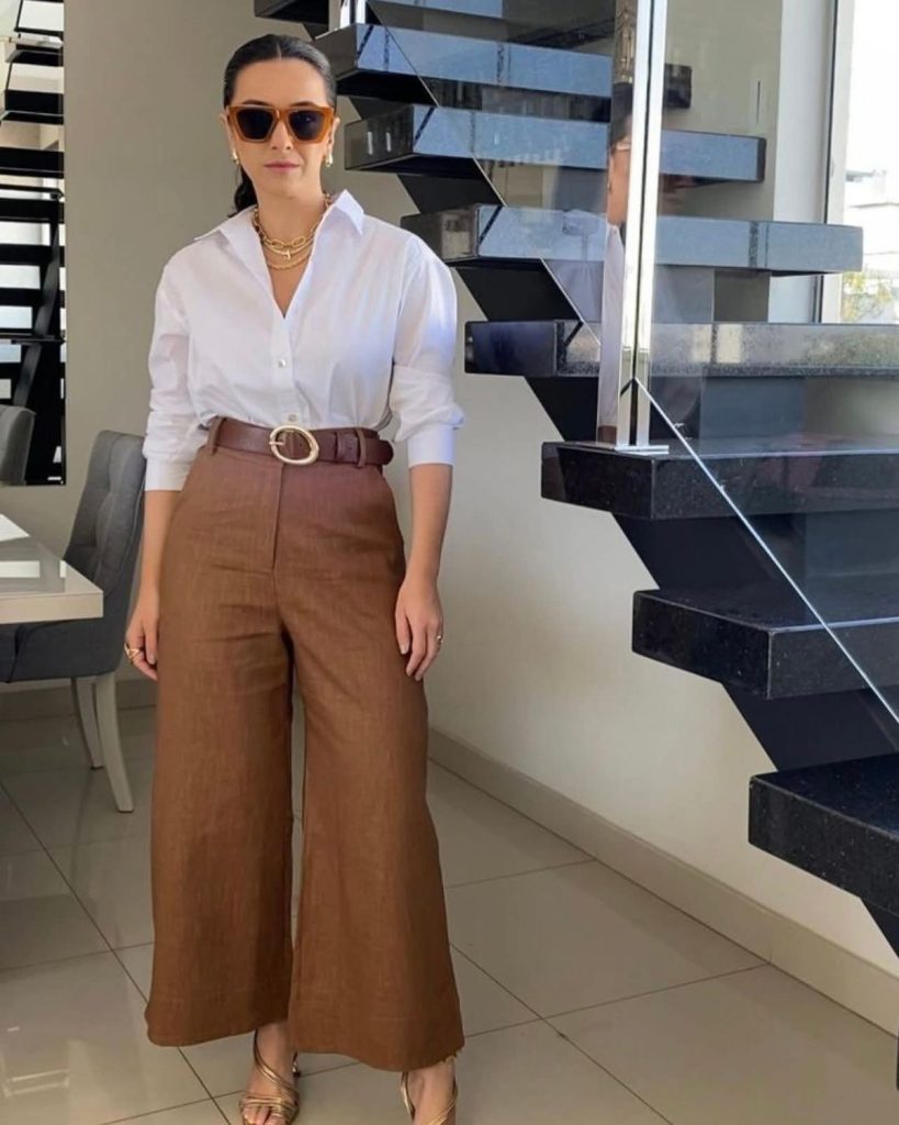 White shirt with high-waisted brown wide-leg linen trousers
