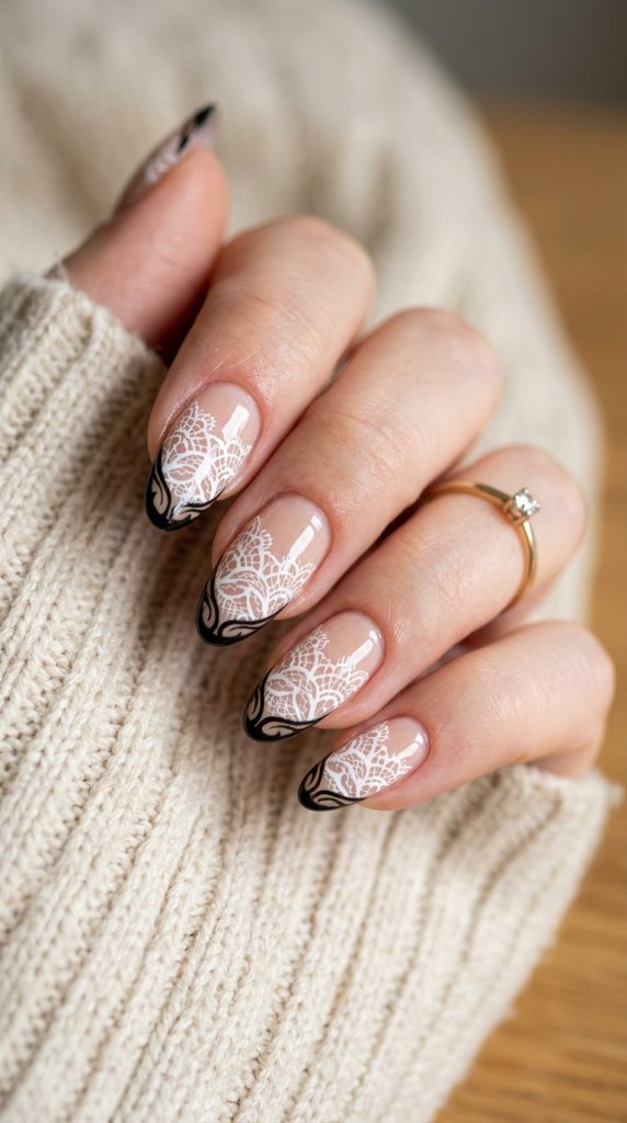 Nails with delicate white lace patterns on nude
