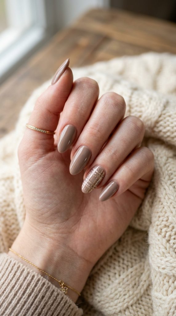 Neutral nails with a single plaid accent