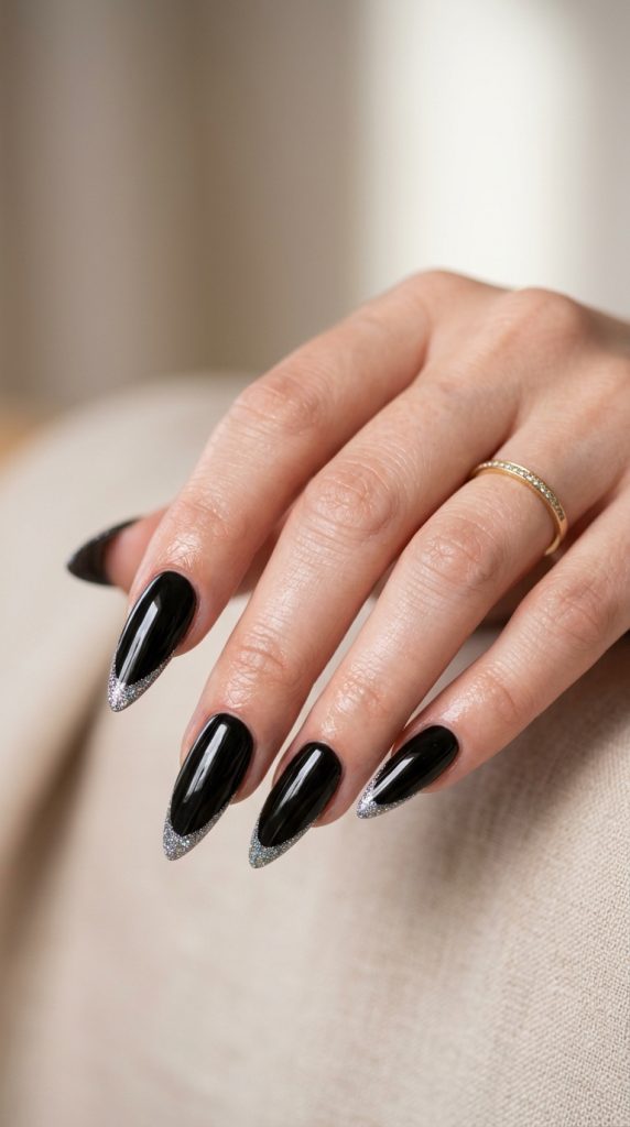 Glossy jet black stiletto nails
