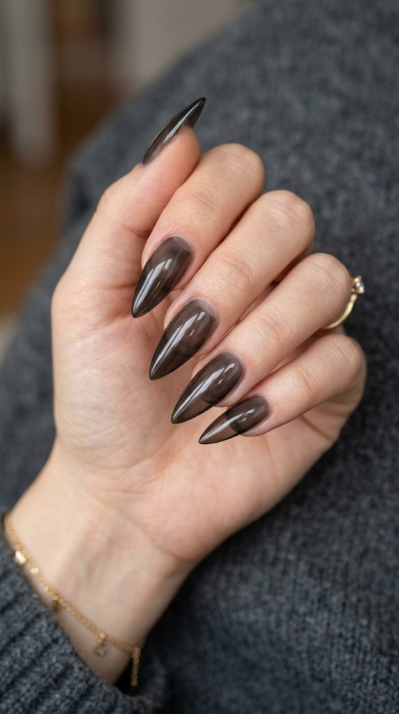 Sheer tinted black stiletto nails