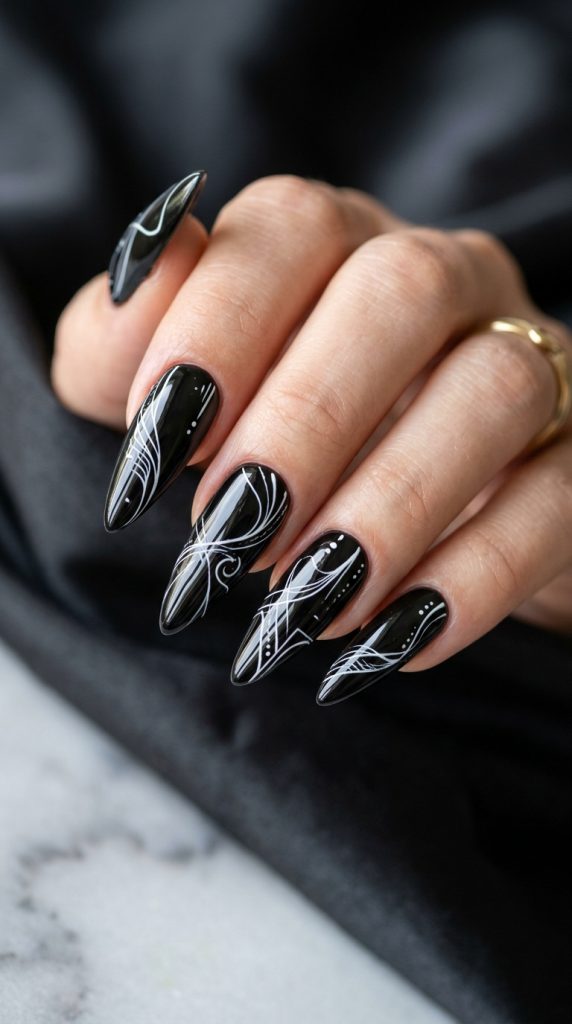 Black stiletto nails with white line art