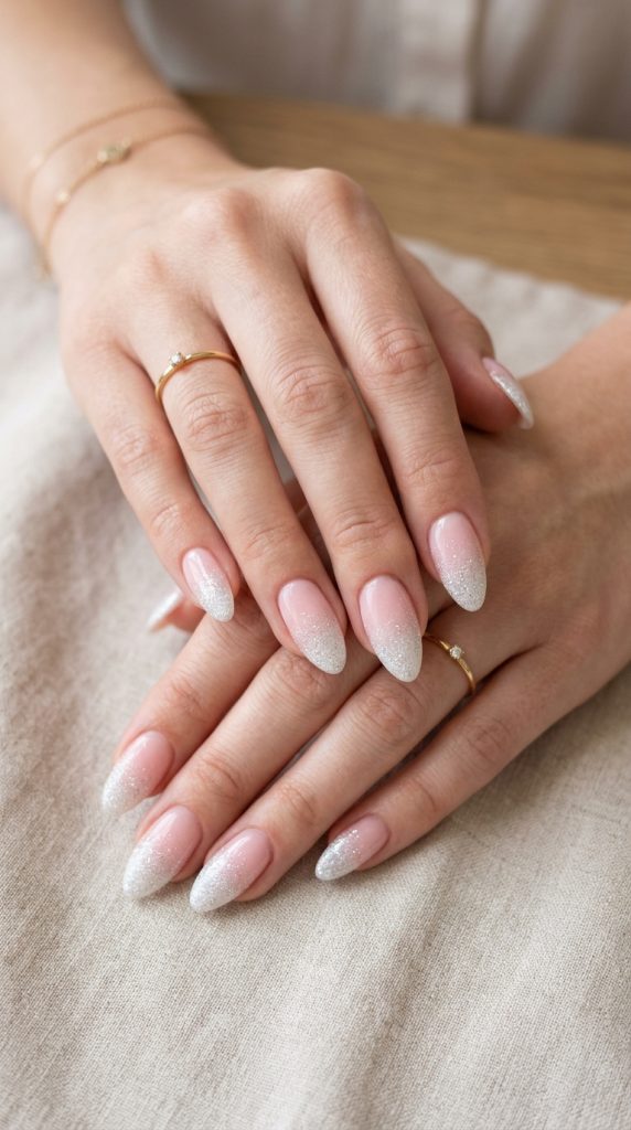Ombre gradient dip nails transitioning from soft blush pink base to crisp white tips