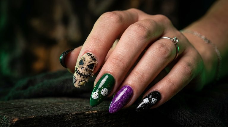 Spooky-glam, purple and black Halloween nails with a stitched sack face