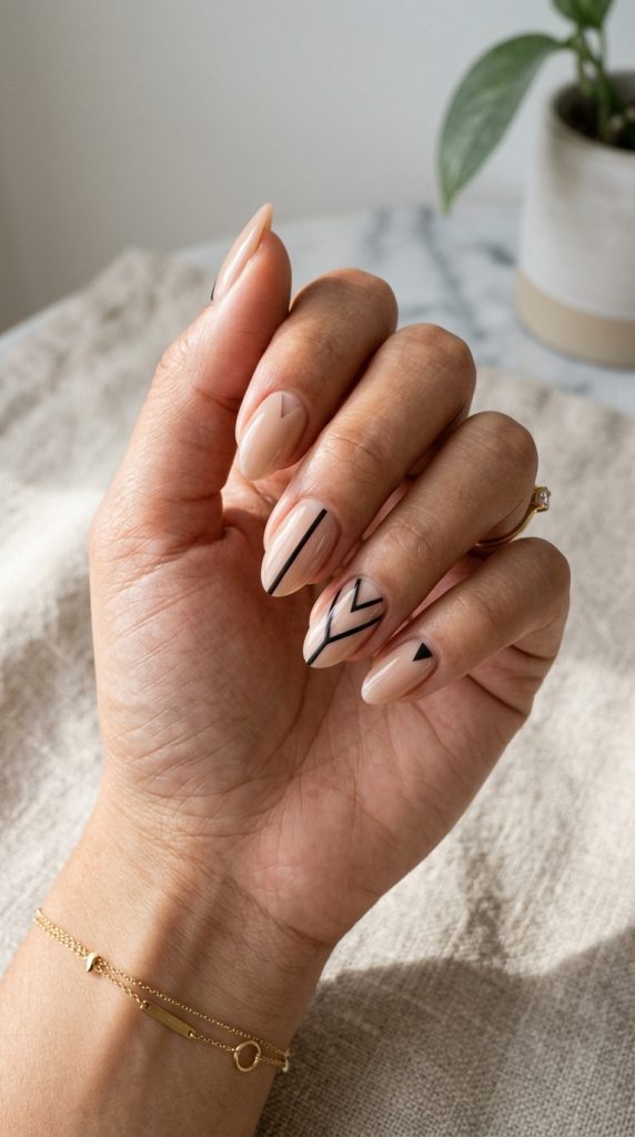 Nude manicure with geometric negative space nail art design