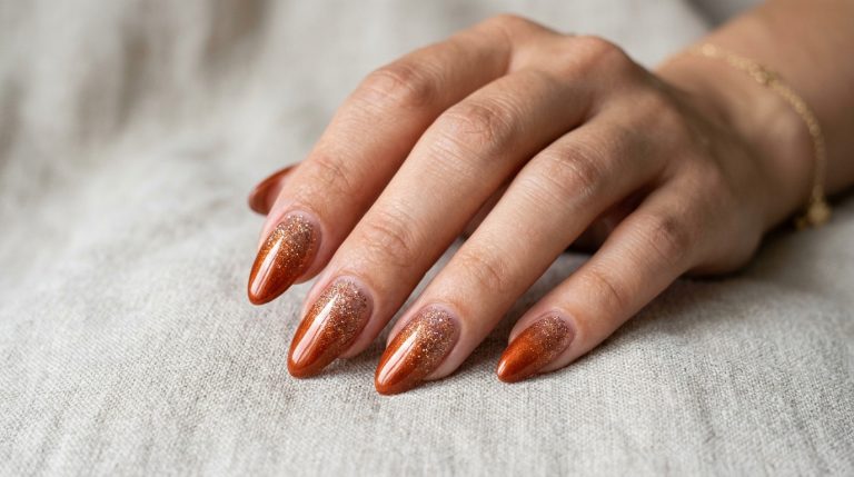 Rust to cream ombre nails on almond-shaped nails
